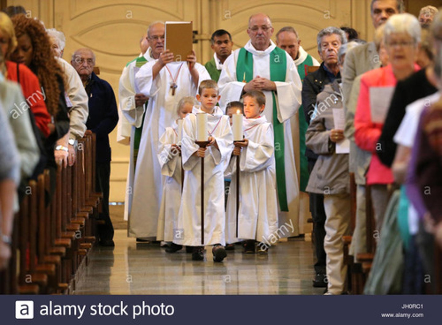 <p>(beginning of mass, from the back of the church to the altar) pilgrimage from this world to the Kingdom of Heaven; Christ lights the way for us.</p>
