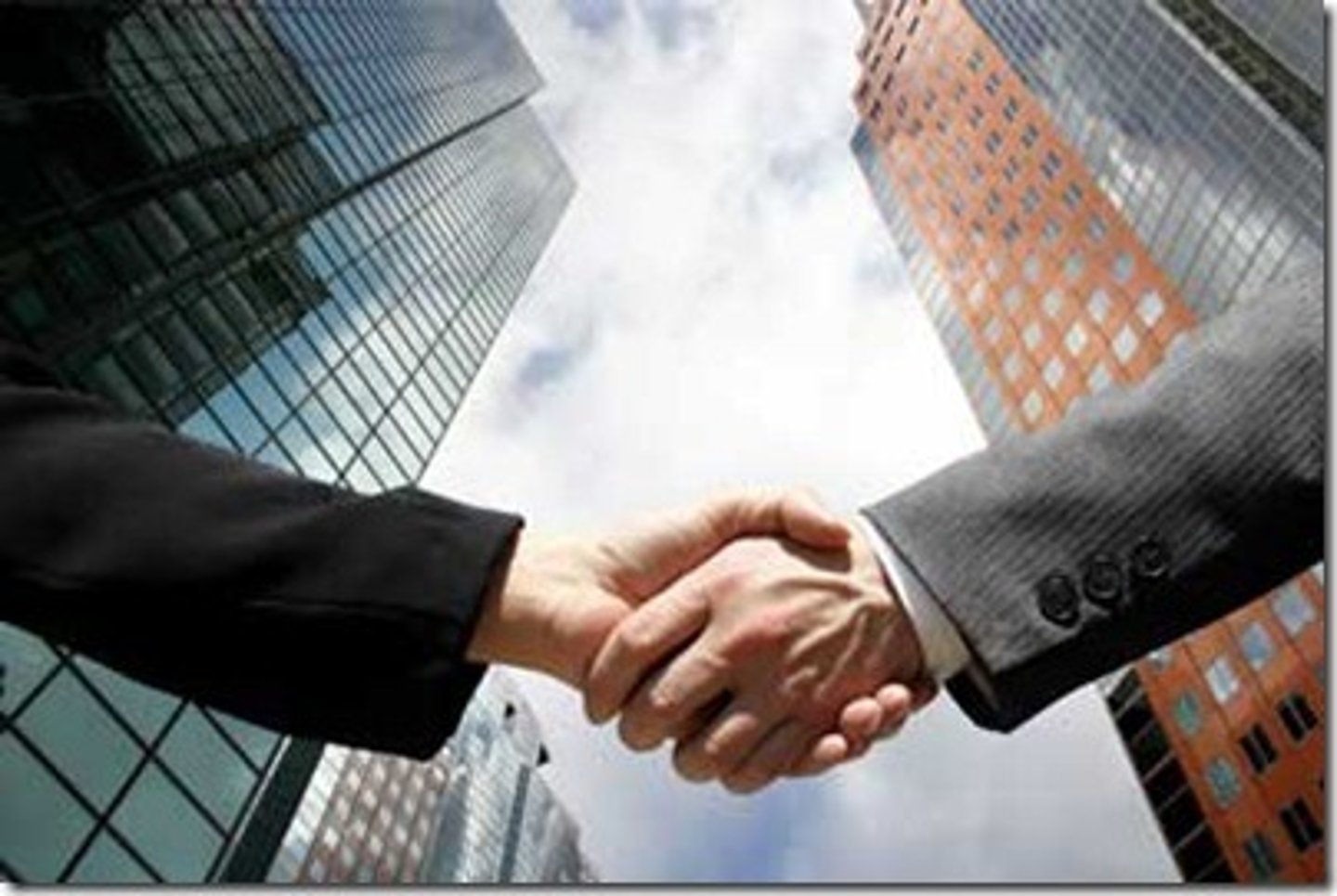 <p>something such as a building, another company, or a piece of land that is bought by a company, or the act of buying it</p>