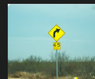 Warning sign: Right curve ahead sign

\
