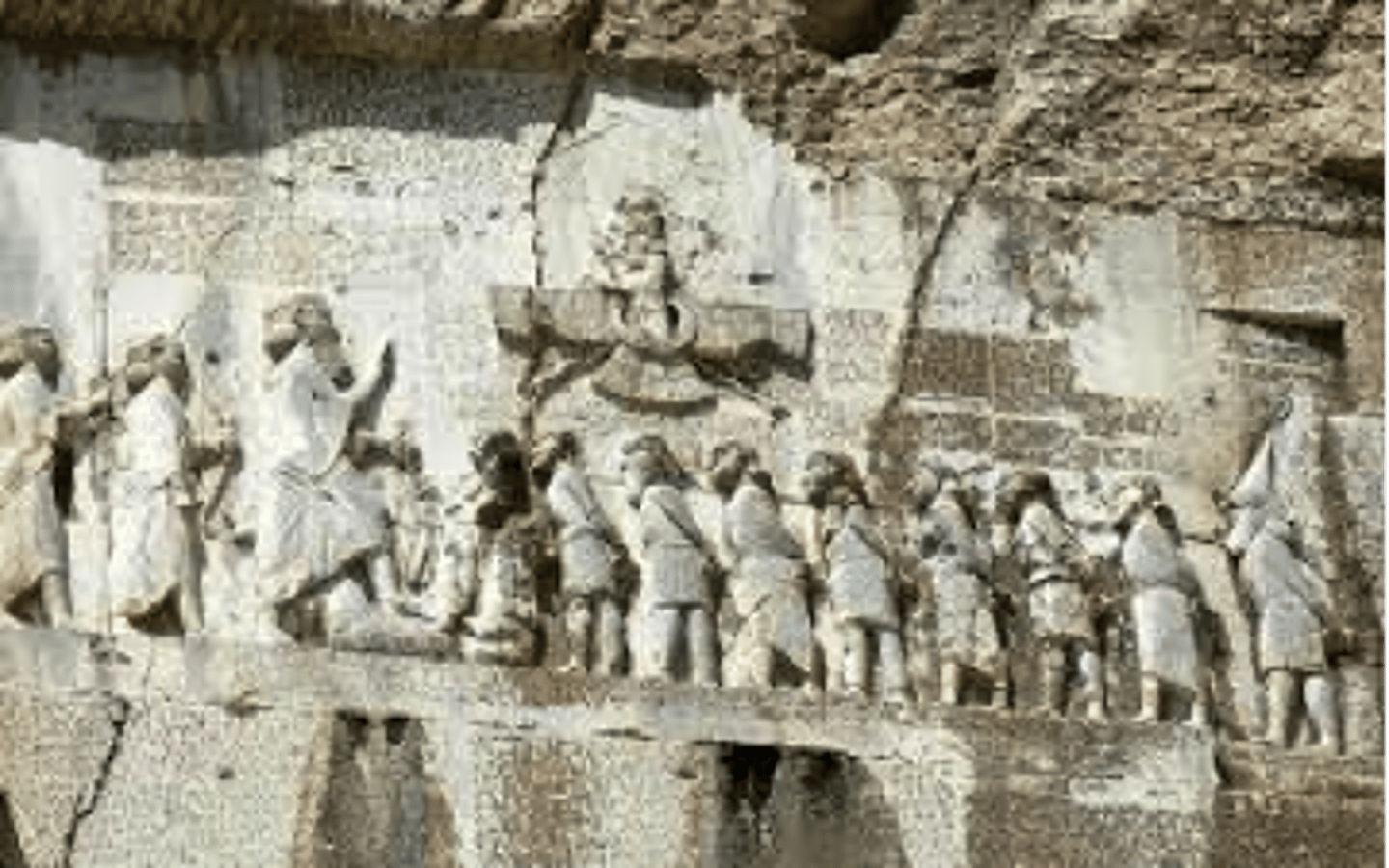<p>Inscription of King Darius I on cliff at Behistun, Iran, shows his court. 6th century BC.</p>