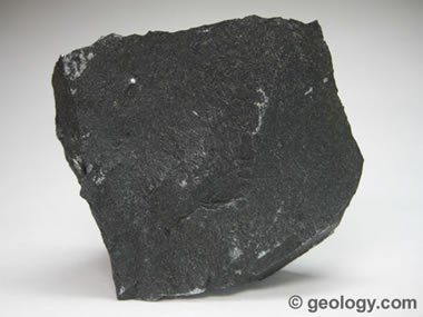 <p>What is the texture of basalt and what type of cooling cause it?</p>