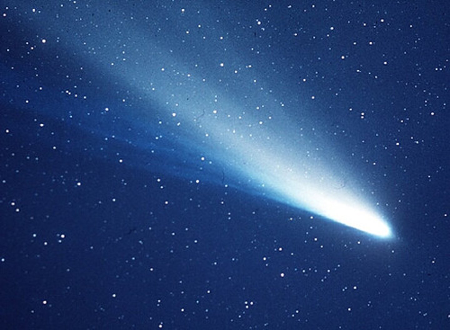<p>A ball of frozen dust and rock that orbits the sun and has a tail that glows</p>