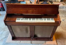 <p>a percussion instrument that looks like a small upright piano. Instead of strings, it has metal bars and sounds twinkly.</p>