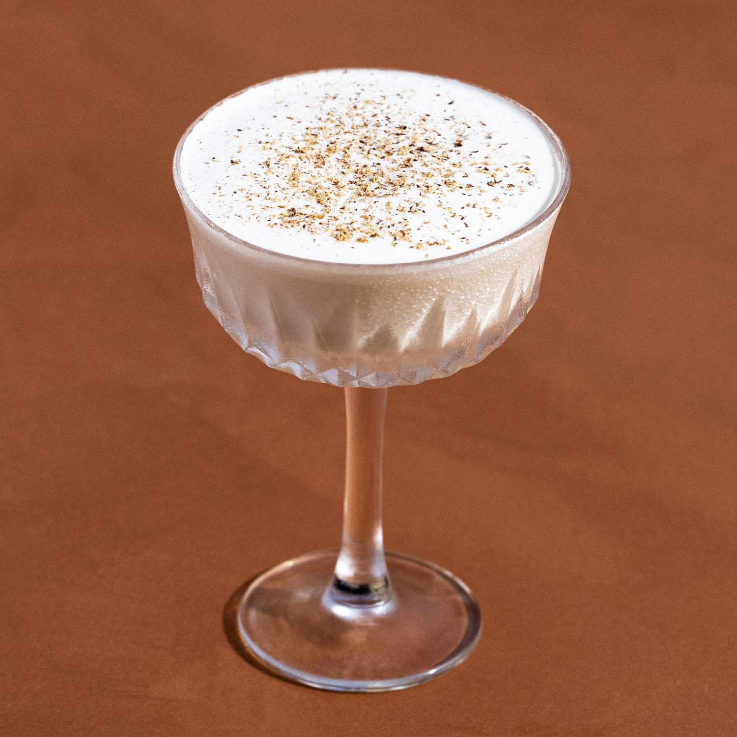 <p>coffee/cream, 1 oz brandy, 1 oz brown creme de cacao, 1 oz heavy cream, served straight up, no garnish</p>