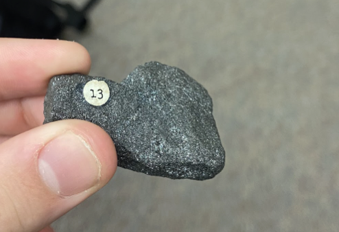 <p>Shiny, looks like magnet shavings, Very distinct sparkles in light, <strong>Iron ore</strong></p>