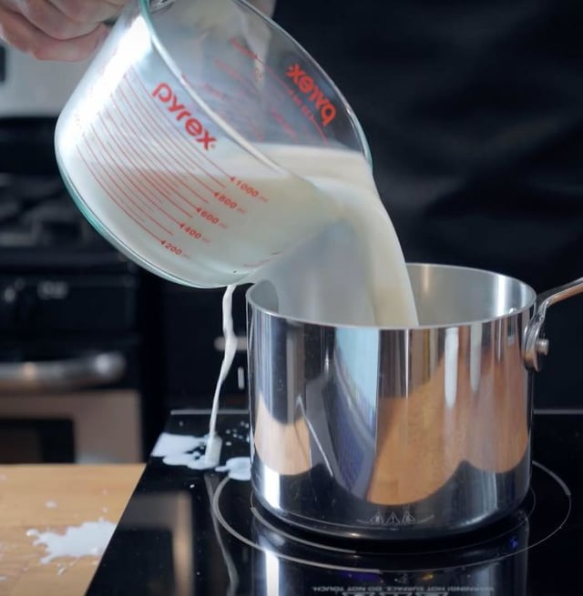 <p>pouring the milk</p>