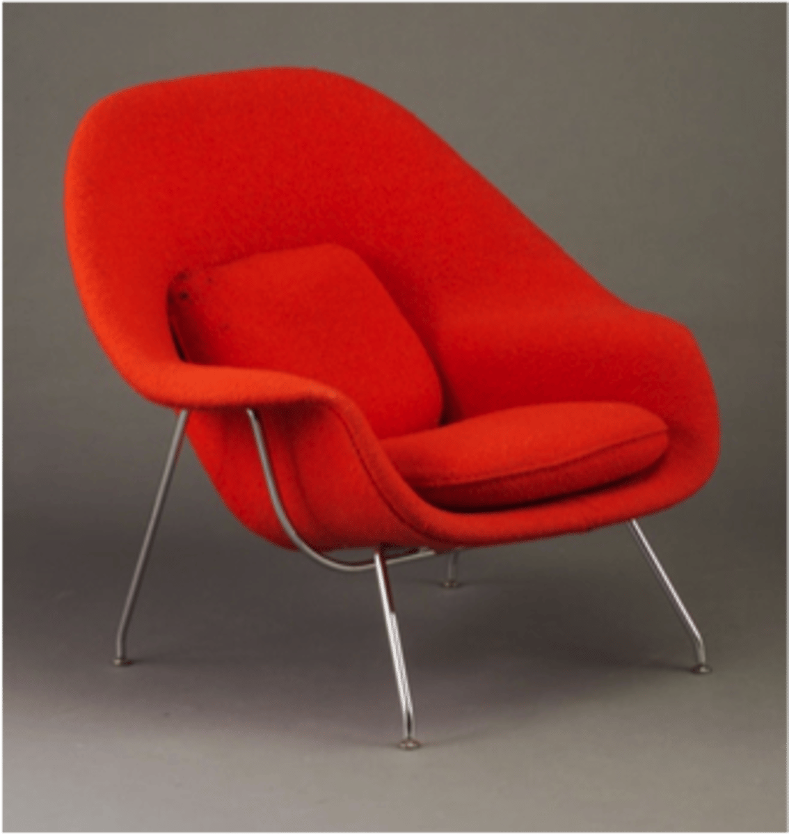 <p>Eero Saarinen's chair and ottoman, designed for Knoll Associates, are made from fibreglass upholstered in foam-filled fabric over a bent tubularsteel frame.</p>