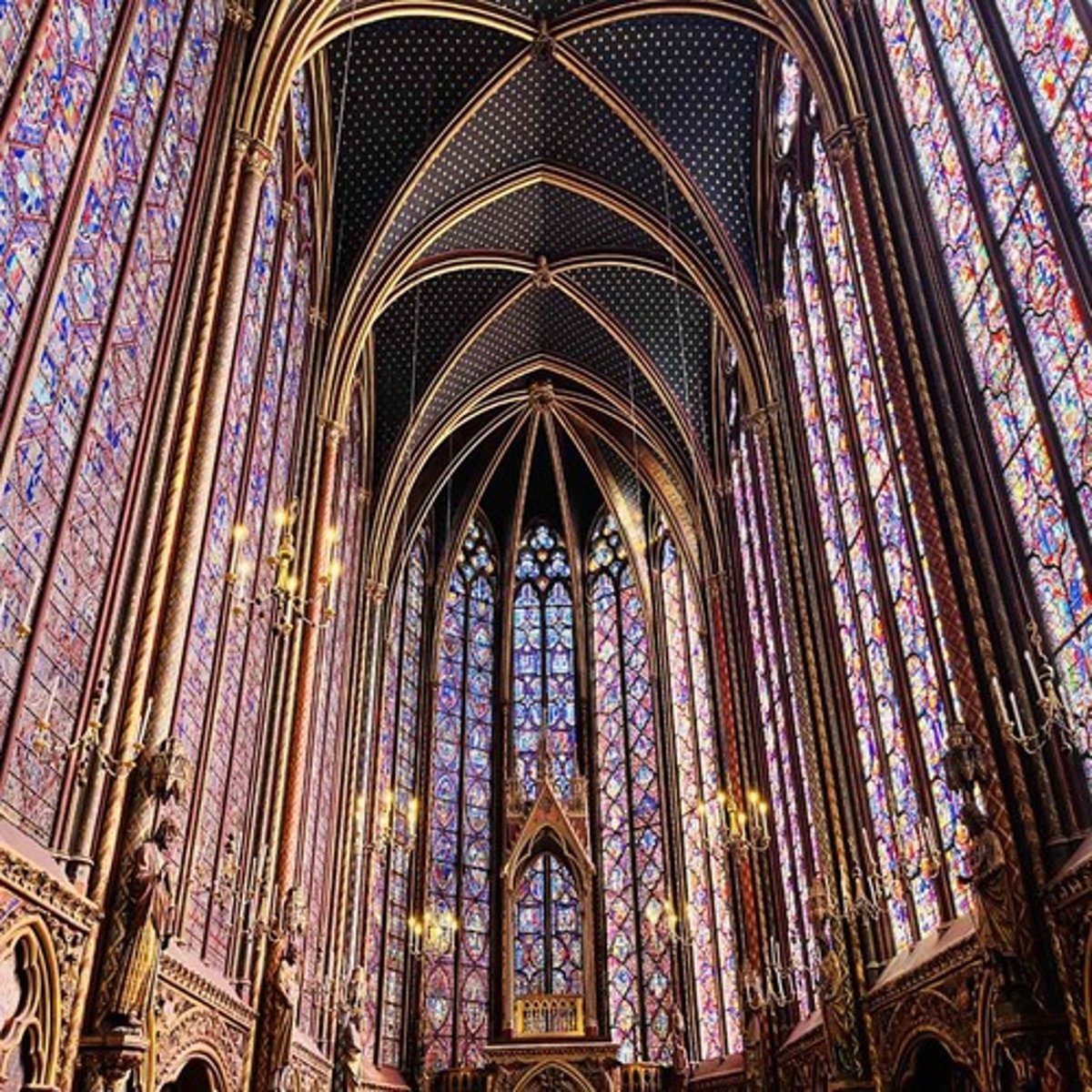 <ul><li><p><span style="background-color: transparent;"><span>Commissioned by Louis IX as part of the royal palace</span></span></p></li><li><p><span style="background-color: transparent;"><span>Built to house Crown of Thorns, fragments of the True Cross, and other relics acquired from Constantinople</span></span></p></li><li><p><span style="background-color: transparent;"><span>Served as both reliquary and a symbol of Capetian monarchy divine legitimacy</span></span></p></li><li><p><span style="background-color: transparent;"><span>Characterized by extreme emphasis on light and verticality</span></span></p></li><li><p><span style="background-color: transparent;"><span>Two Levels:&nbsp;</span></span></p></li><li><p><span style="background-color: transparent;"><span>Lower Chapel: For palace staff, decorated with painted vaults and polychrome columns</span></span></p></li><li><p><span style="background-color: transparent;"><span>Upper Chapel: Reserved for king and relics, dominated by immense stained glass walls</span></span></p></li><li><p><span style="background-color: transparent;"><span>Stained glass windows depicting biblical history from Genesis to Christ’s Passion</span></span></p></li><li><p><span style="background-color: transparent;"><span>Delicate stonework frame creates a “cage of light.”</span></span></p></li></ul><p></p>