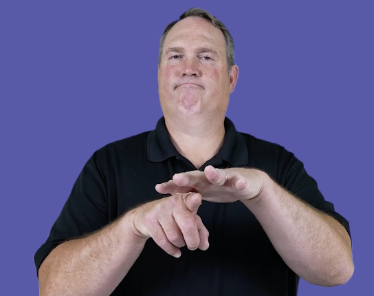 <p>Similar movement as&nbsp;“mainstream”, but you will point your left index finger under your right palm as you collide your hands together</p>