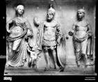 <p>likely depicts the cult statues of the Temple of Mars Ultor, featuring figures of Mars, Venus, and Divus Julius (deified Julius Caesar). </p>