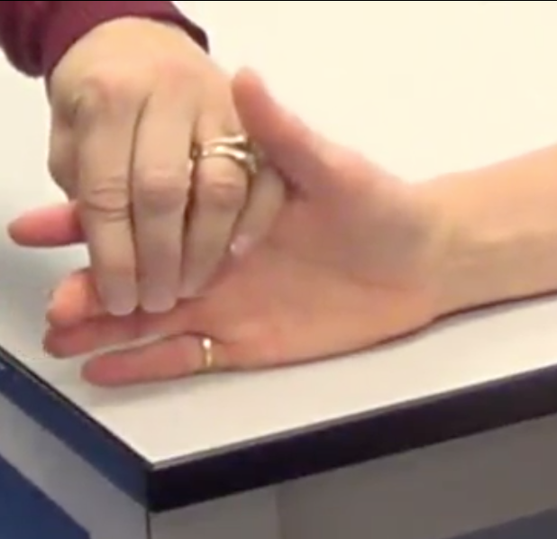 "Relax your fingers. All right can you bend the tip of this finger for me?"