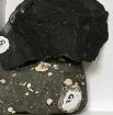 <p>Igneous, compact, fine-grained, and glassy, black in color and weather to dark green or brown</p>