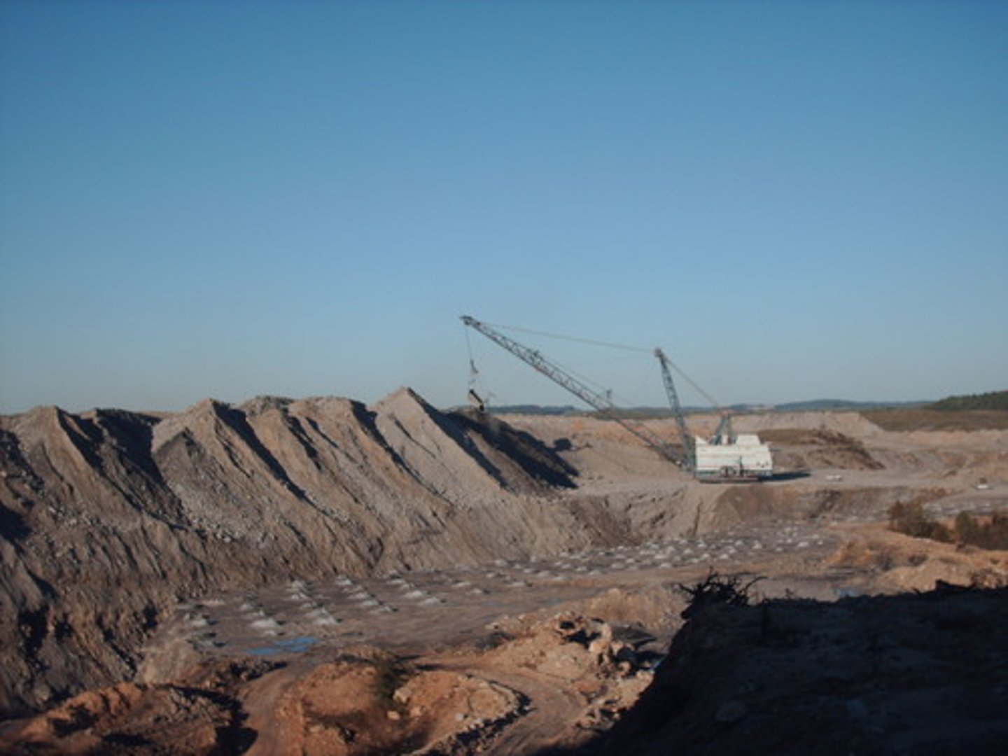 <p>Layer of soil and rock overlying a mineral deposit. Surface mining removes this layer.</p>