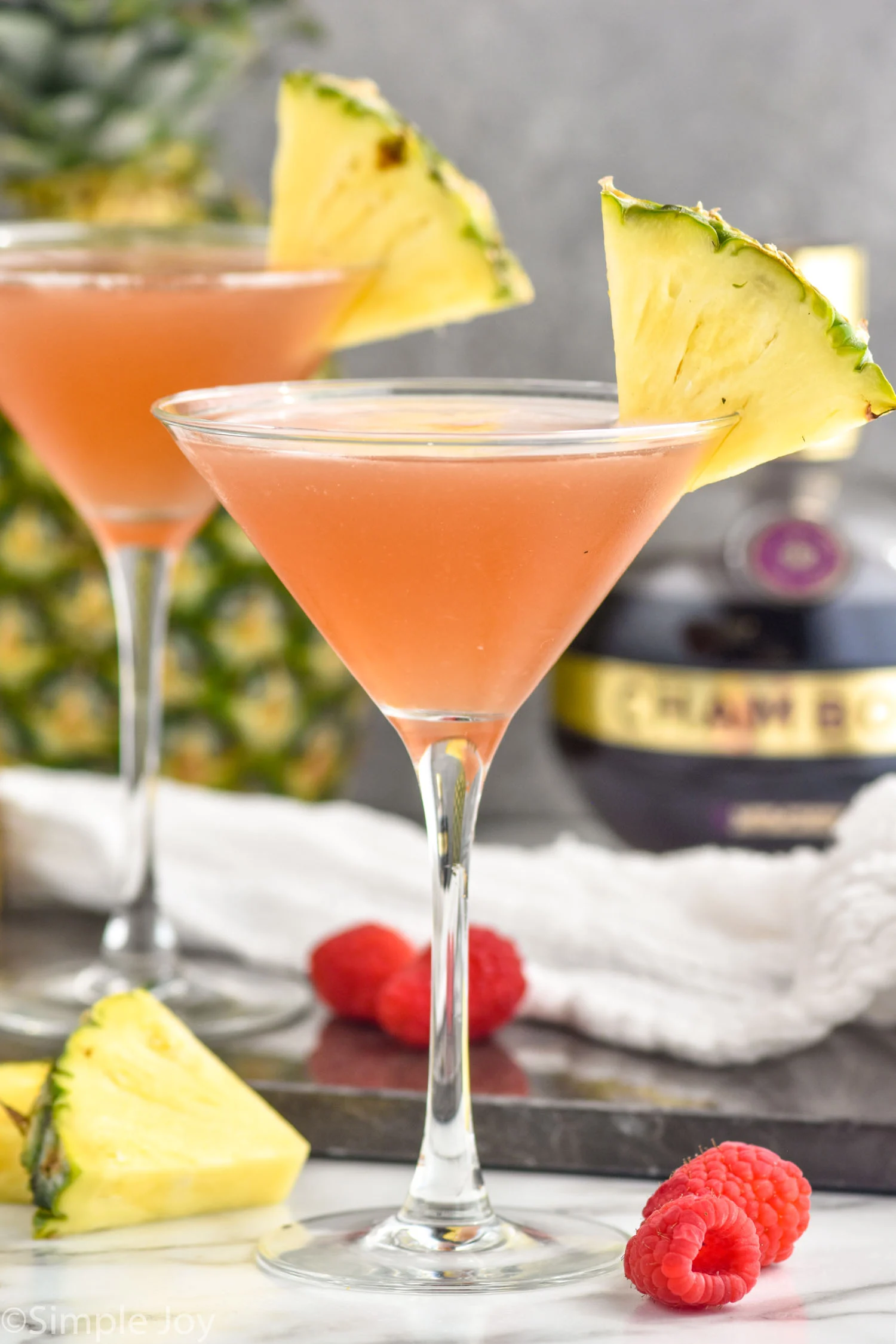 <p>sour, 1.5 oz vodka, 0.5 oz Chambord, 1.5 oz pineapple juice, served straight up, garnished with lemon twist</p>