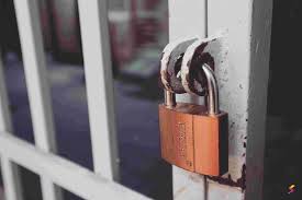 <p>To secure something with a lock (e.g., a building, valuables).</p><p></p>
