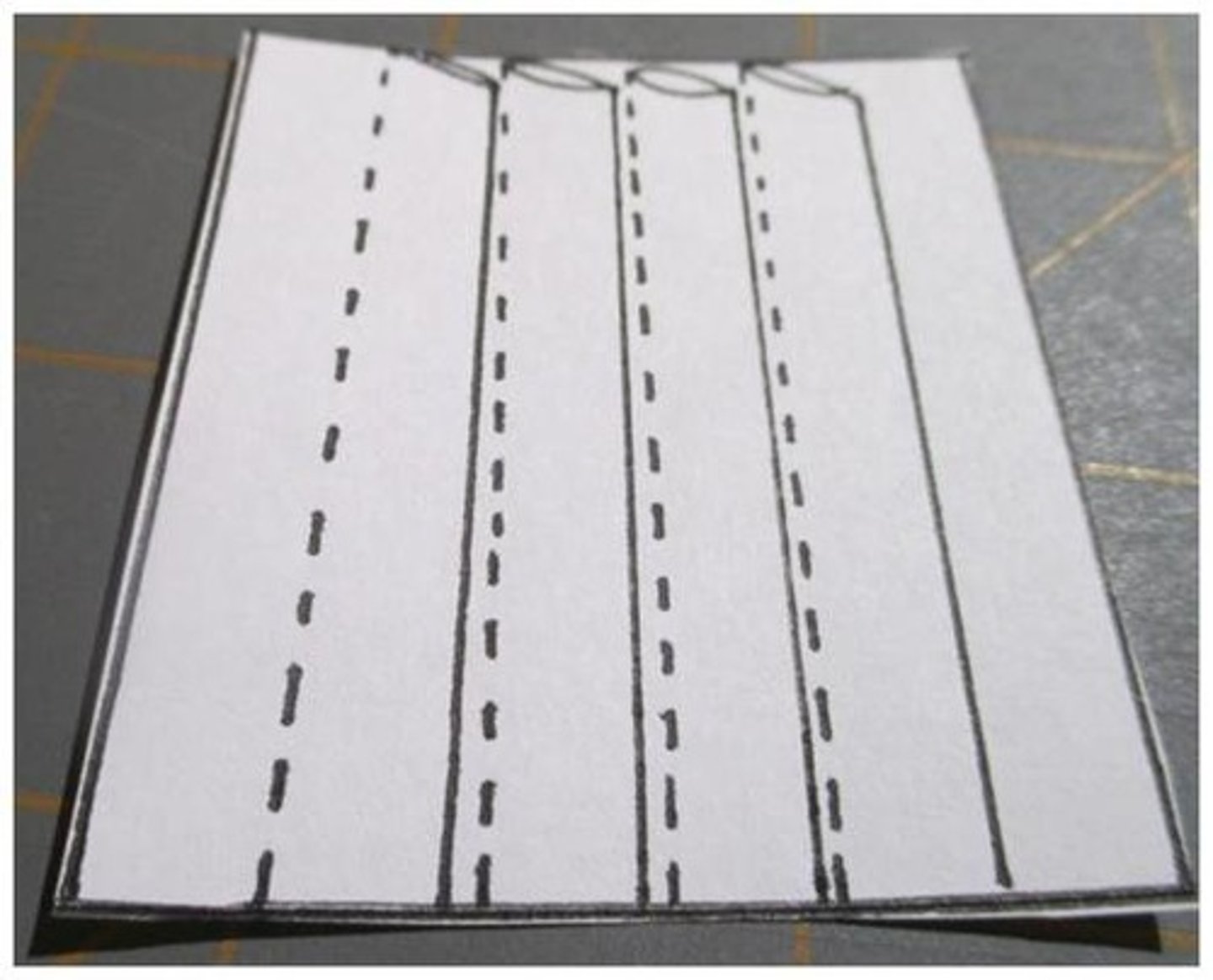 <p>narrow and stitched along their length - decorative feature</p>