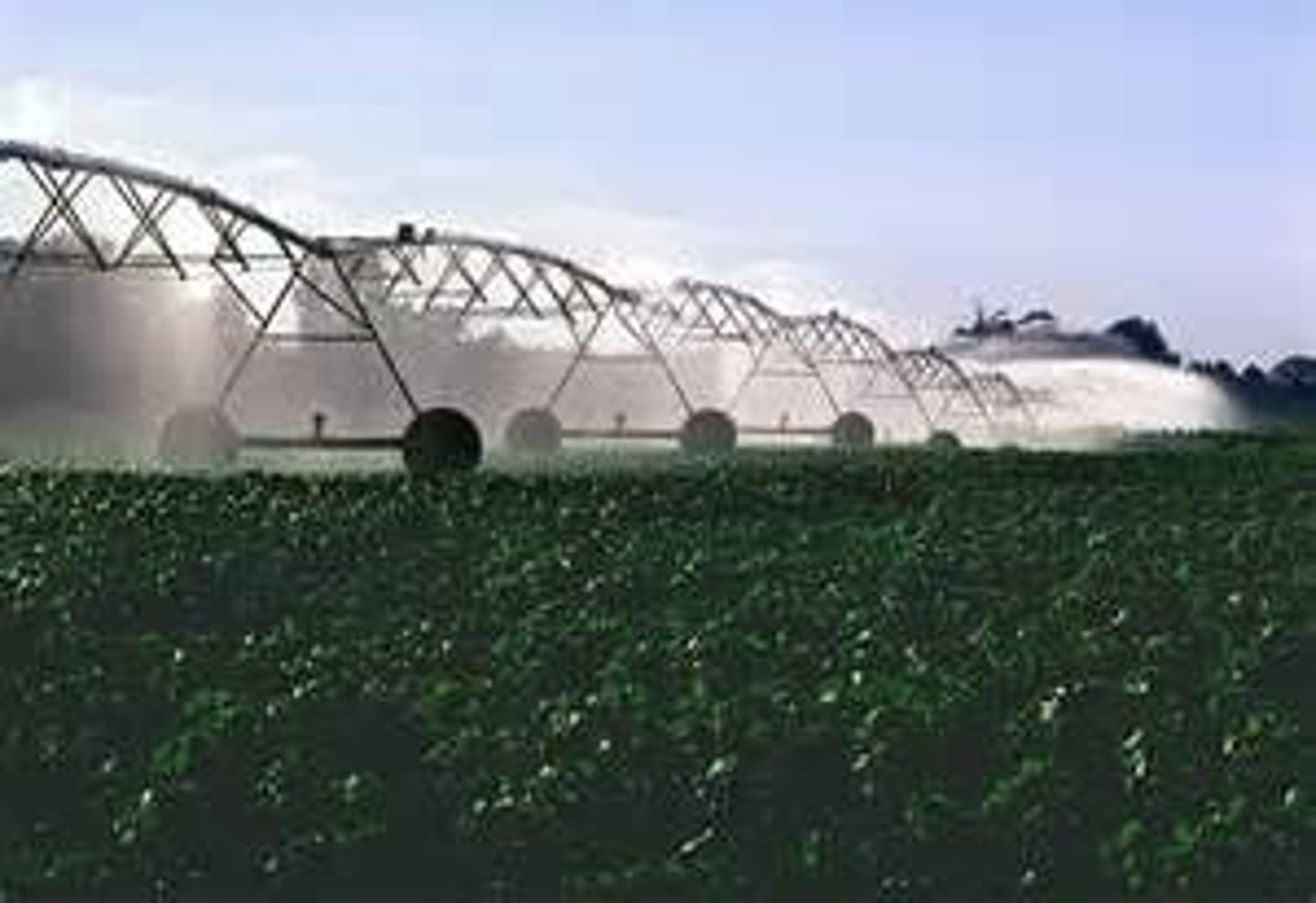 <p>Involves pumping ground water into spray nozzles across an agricultural field. This system is more efficient than flood and furrow irrigation, with only 1/4 or less of the water lost to evaporation or runoff. However, it is more expensive, and also requires energy to run.</p>