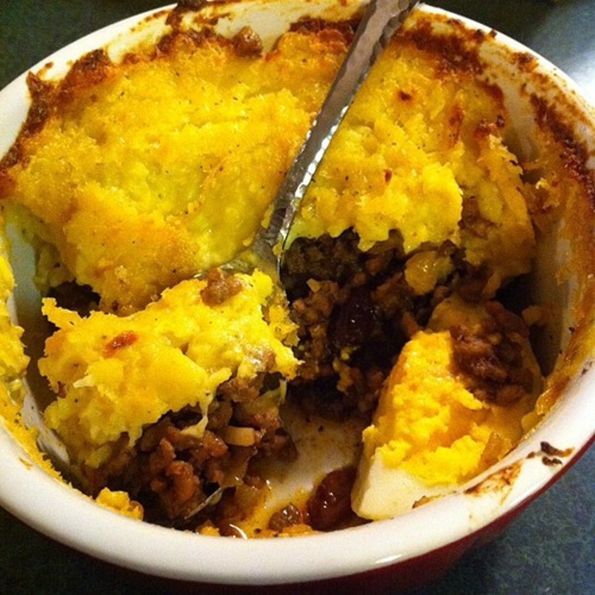 <p>Meat pie topped with mashed corn</p>