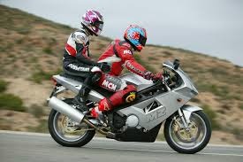 a seat for a passenger behind a motorcyclist.