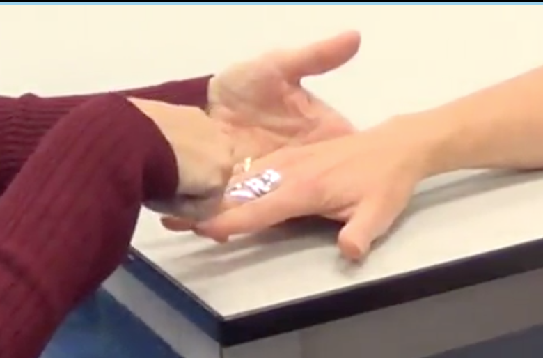 -Have them start with their fingers wide apart
-Put your pointer finger in between their middle phalanx and tell them to close their fingers on yours 
-"Don’t let me pull my finger out"