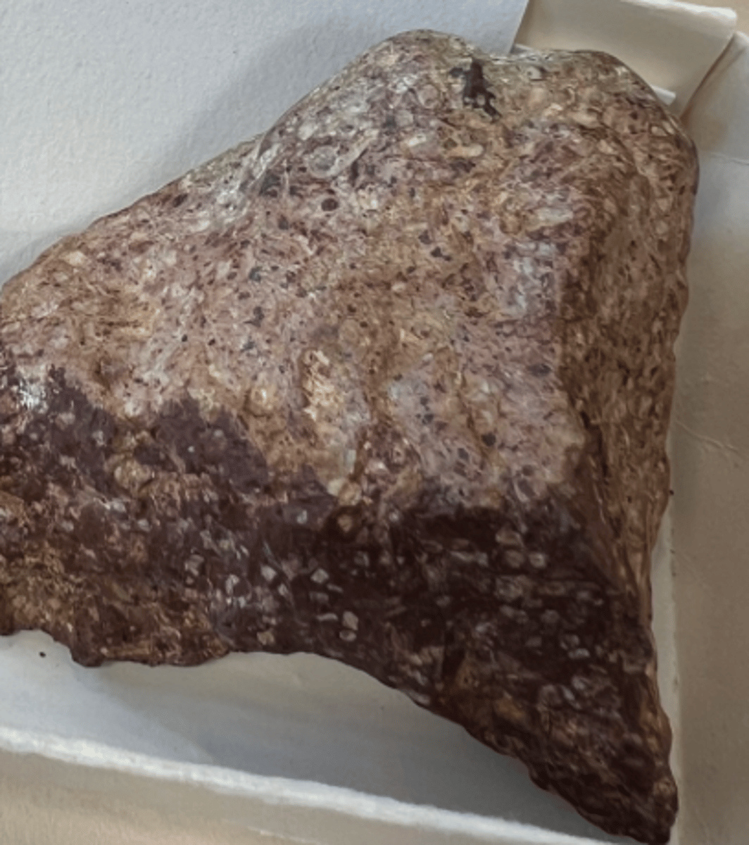 <p>the defining feature is the presence of larger crystals or phenocrysts embedded in a finer-grained groundmass or matrix. The phenocrysts are usually larger than the surrounding matrix and are easily visible to the naked eye</p>