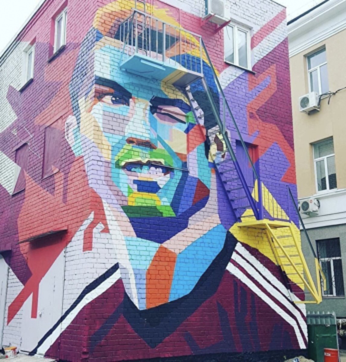 <p>a) Commissioned to create murals of soccer players during the World Cup</p>