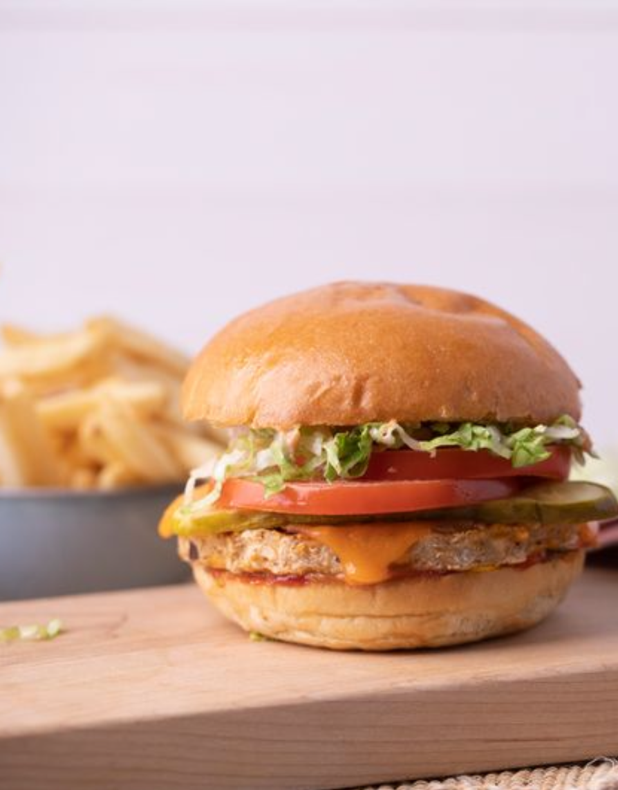 <p><span>➔ Three grain veggie patty , Cheddar cheese, Lettuce, Relish-mayo,  Mustard,  Brioche bun (or gluten free bun available), Pickle, Tomato, Ketchup</span></p>