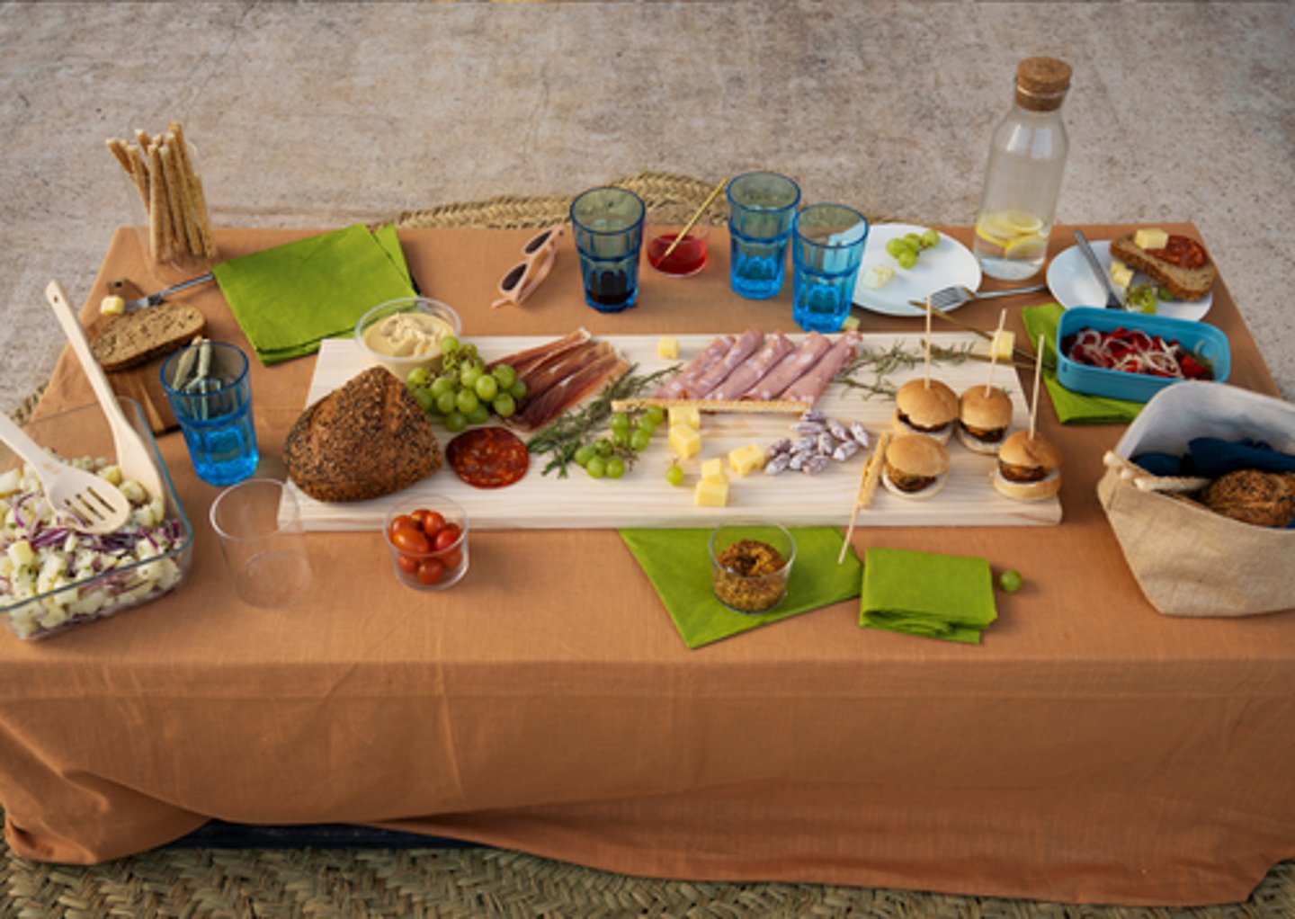 <p>to put plates, cutlery, glasses, and napkins on the table before a meal.</p><p>Before the guests arrived, I helped my mum _________ with paper plates, plastic cutlery, and bottles of sauce.</p>