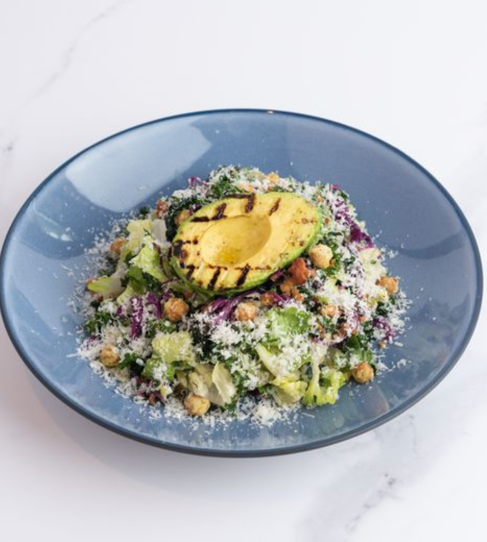<p><span><em>Balanced and full of texture, this salad is perfect as a healthy side dish or light lunch!</em></span></p><p></p><p><span>crispy chickpeas, grilled avocado, pickled red cabbage, fennel chili crumb, grana padano, lemon garlic dressing. <strong>add chicken</strong> <strong>+7</strong>| <strong>add salmon +9¼</strong></span></p><p></p><p><span>➔ Grilled Avocado ➔ Crispy Chickpeas</span></p><p><span>➔ Pickled Red Cabbage ➔ Grana Padano</span></p><p><span>➔ Marinated Kale ➔ Romaine<br>➔ Lemon Garlic Dressing</span></p><p><span>➔ Olive Oil ➔ Fennel Chili Crumb</span></p>