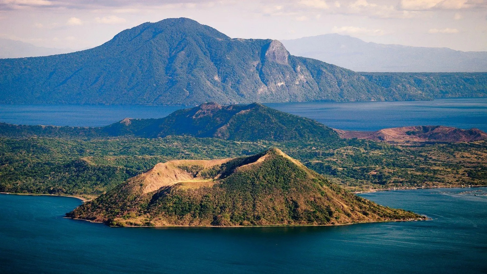 <p><span style="color: rgb(0, 0, 0)">Formerly known as Bombón Lake, a freshwater caldera lake in the province of Batangas.</span></p><p><span style="color: rgb(0, 0, 0)"><br>The lake fills Taal Volcano, a large volcanic caldera formed by very large eruptions between 500,000 and 100,000 years ago</span></p>