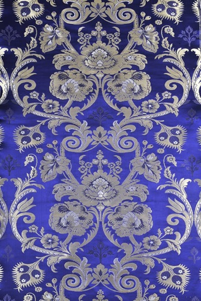 <p>- reversible patterned fabric</p><p>- often silk</p><p>- scrolling floral motifs</p>