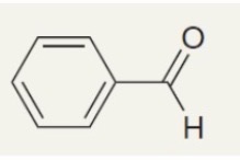 <p>Systematic: Benzenecarbaldehyde</p><p>Common: Benzaldehyde</p>