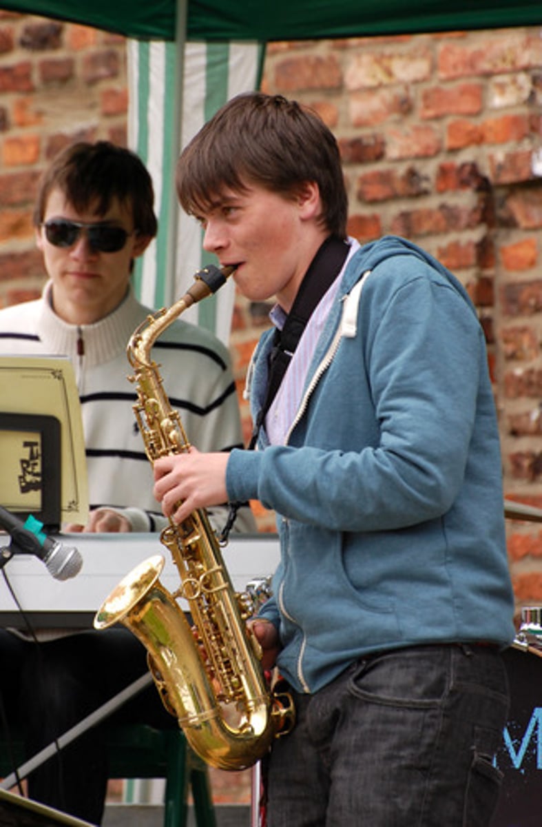 <p>We play the saxophone</p>