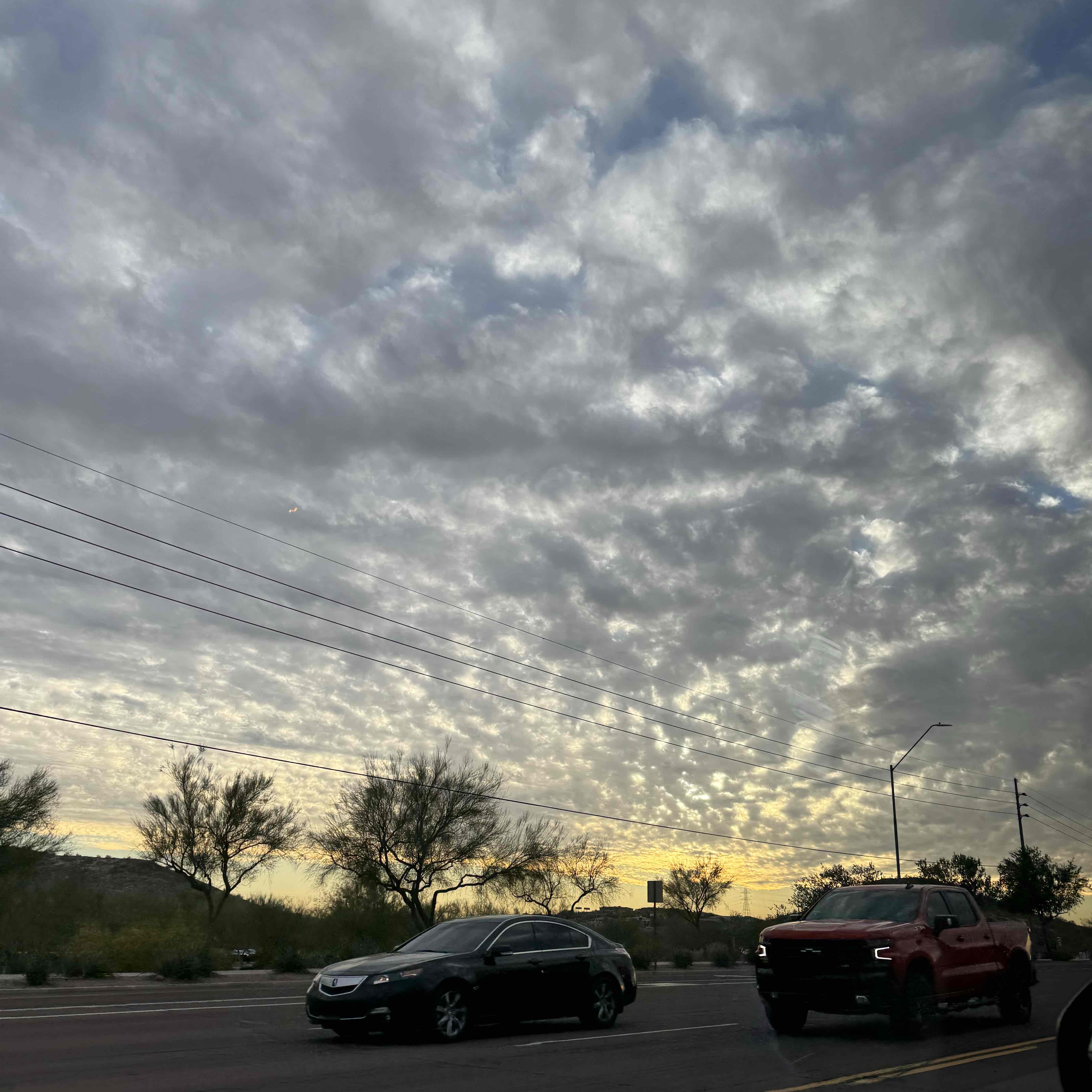 <p>Middle-altitude, puffy marshmallow clouds close together.</p>
