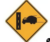Construction traffic could be leaving or entering the road on the right and may be moving slower than through traffic.

\
