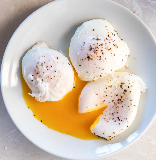 <ul><li><p>to cook an egg in or over gently boiling water, without its shell</p></li></ul><p><em>We had =…= eggs for breakfast.</em></p><p><em>=…= the eggs for 4 minutes...</em></p>