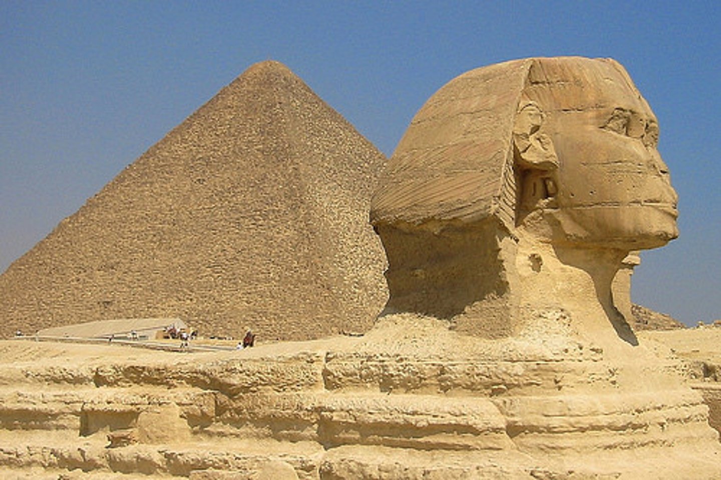 <p>- A colossal limestone statue with the body of a lion and head of pharaoh Khafre</p><p>- Carved around 2500 BCE directly from the bedrock at Giza</p><p>- Stands ~73 meters long and ~20 meters tall — the largest monolithic statue in the world</p><p>- Associated with the sun god Ra-Horakhty; may have served as guardian of the necropolis</p><p>- Heavily eroded; parts like the nose were damaged in post-ancient periods</p>