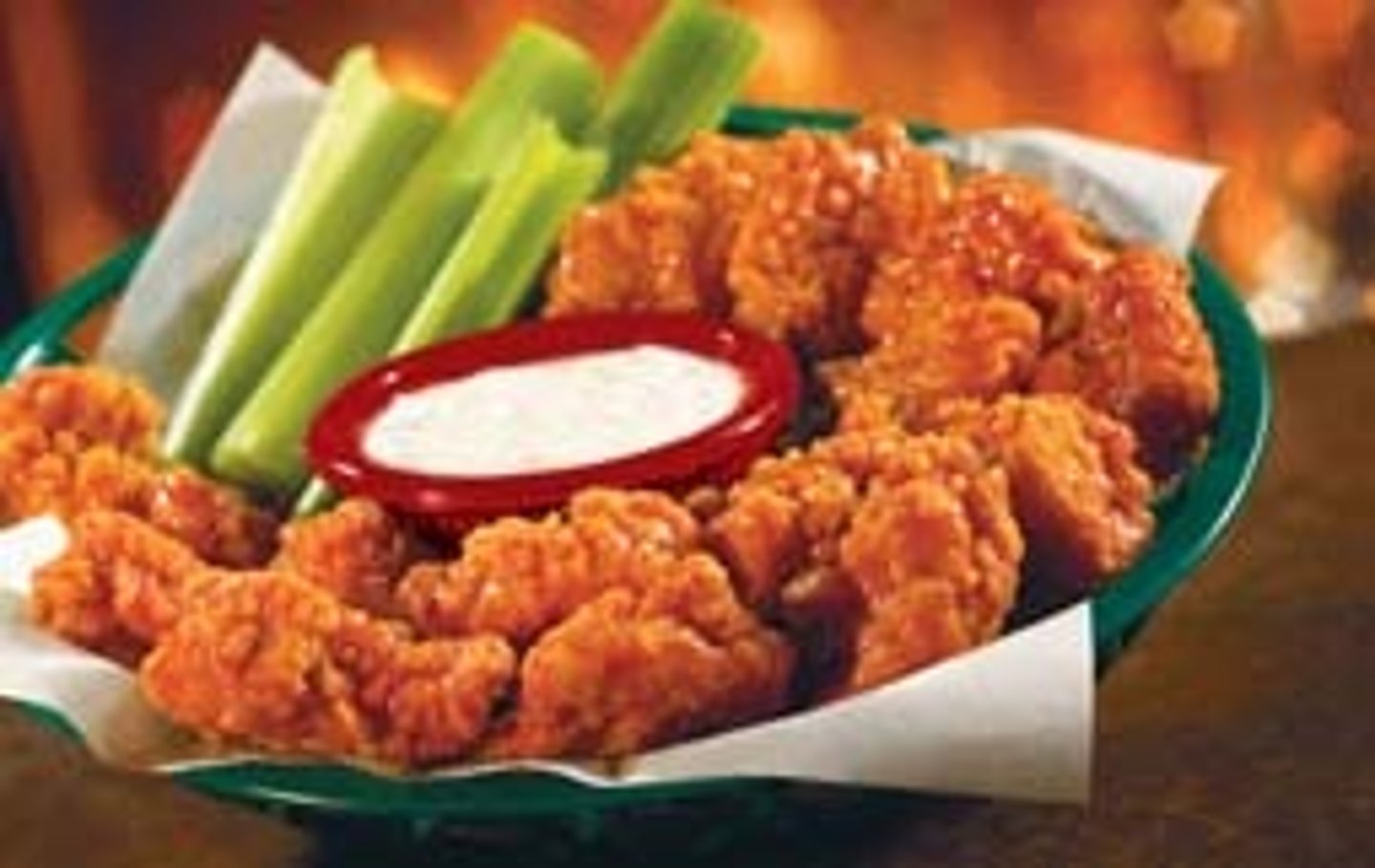 <p>8 oz of hand-breaded all white meat chicken tossed in hot or mild sauce. Even mild is a bit spicy</p><p>bleu cheese &amp; 5 celery sticks</p><p>deli-lined basket</p>