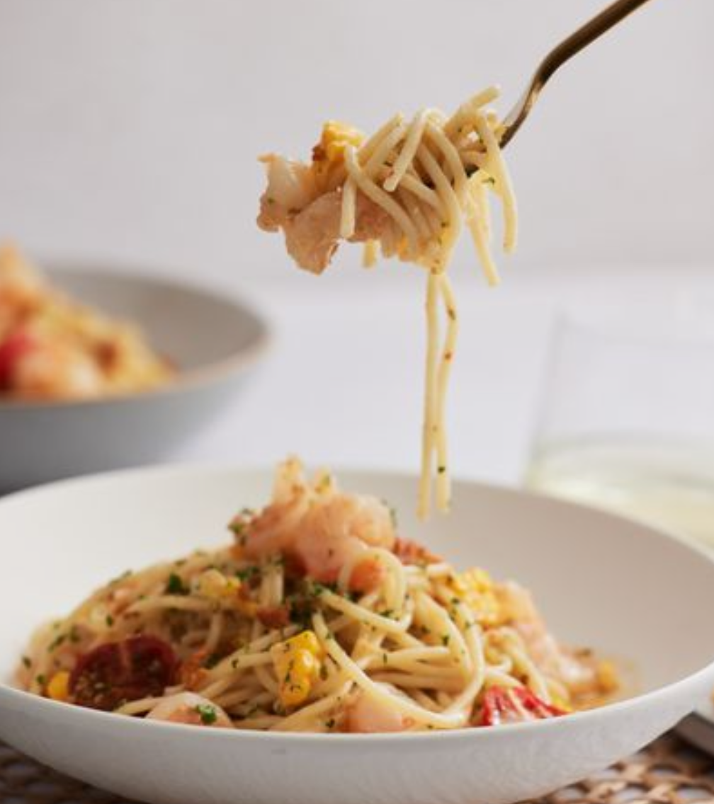 <p><em>Rich, buttery prawn spaghetti, balanced with bright citrus and summer vegetables.</em></p><p>Preset: soup spoon</p><p>Common Allergens: shellfish, soy, dairy, wheat, celiac, egg, white wine</p><p>Ingredients:</p><ul><li><p>Sustainably harvested prawns</p></li><li><p>spaghetti</p></li><li><p>lobster lemon butter sauce (with white wine)</p></li><li><p>roasted gem toatoes</p></li><li><p>corn</p></li><li><p>fennel chilli grumb</p></li><li><p>granda padano cheese</p></li><li><p>parsley</p></li><li><p>garlic crostini</p></li></ul><p></p>