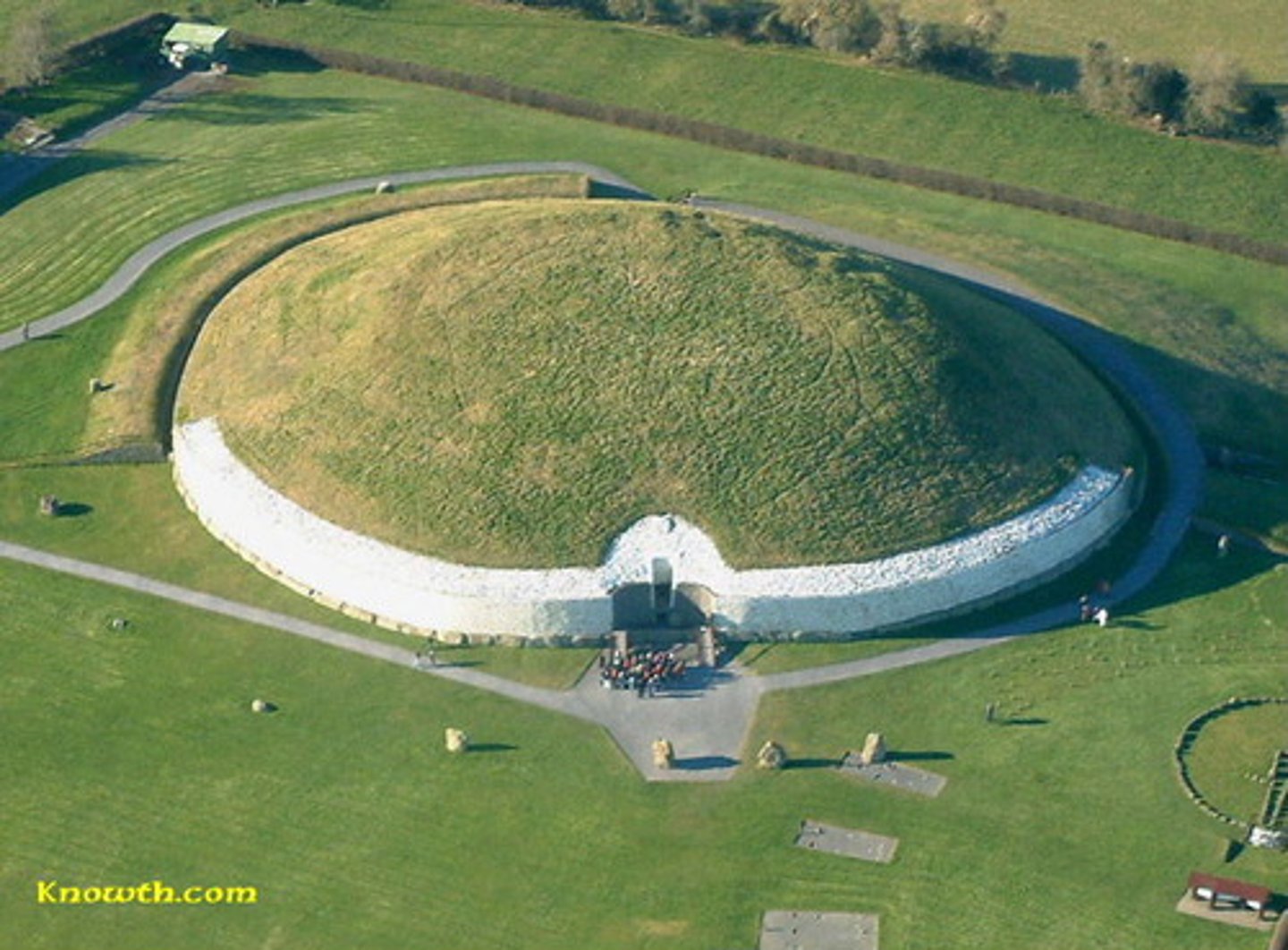 <p>passage tomb, an earth or stone mound over a grave</p>
