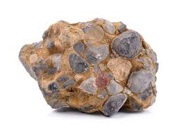 <p>This rock’s base is typically a lightish brown in color, and contains other rocks within it. The inner fragments are not well sorted, but they are well rounded. This is a clastic rock.</p>