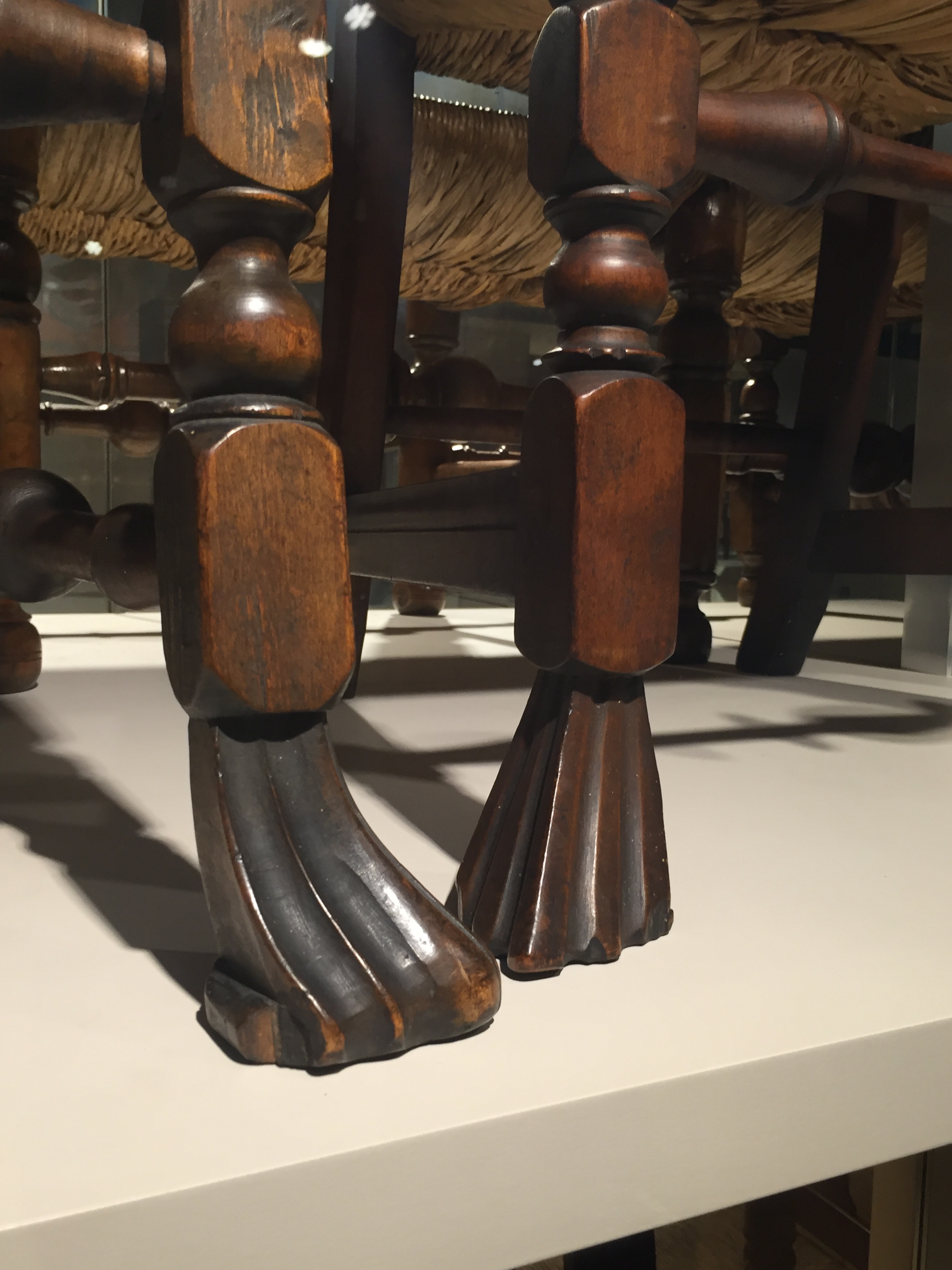 <p>Carved foot terminating a leg and characterized by an inward- turning scroll at the bottom and vertical grooves above creating ribs on the top surface of the scroll</p>