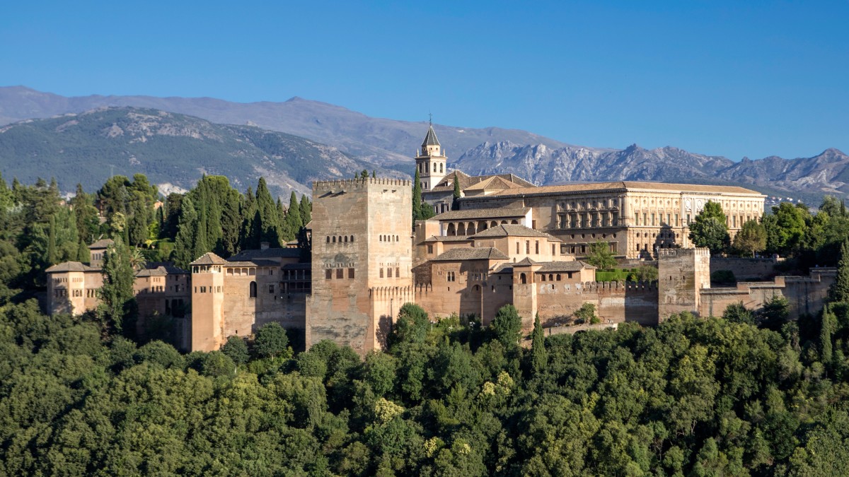 <p>Alhambra</p><ul><li><p>Granada, Spain.</p></li><li><p>Nasrid Dynasty.</p></li><li><p>1354-1391 C.E.</p></li><li><p>Whitewashed adobe stucco, wood, tile, paint, and gilding</p></li></ul><p>The Alhambra&apos;s architecture shares many characteristics, but is singular in the way it complicates the relationship between interior and exterior. Its buildings feature shaded patios and covered walkways that pass from well-lit interior spaces onto shaded courtyards and sun-filled gardens all enlivened by the reflection of water and intricately carved stucco decoration.</p>