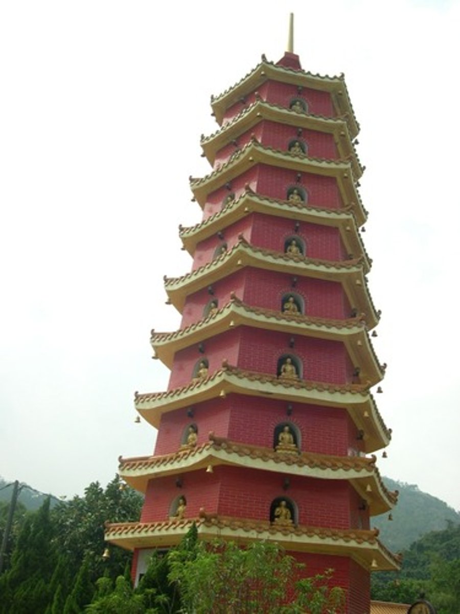 <p>a tower built of many stories. Each succeeding story is identical in style to the one beneath it, only smaller. Pagodas typically have dramatically projecting eaves that curl up at the ends</p>