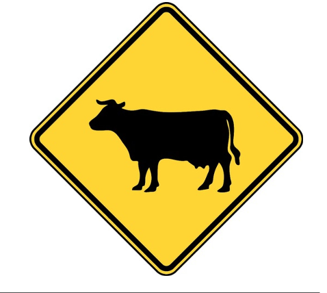 <p>What does a Cattle Crossing sign warn of?</p>