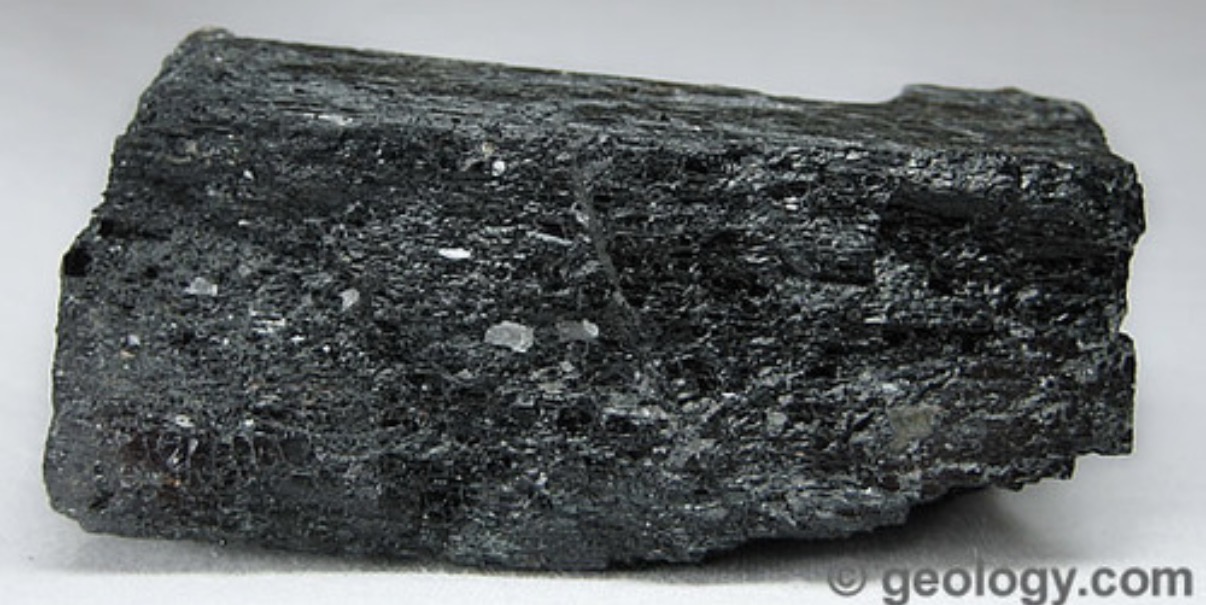 <p>Colorless streak, prismatic fracture, vitreous or silky. Black or dark green color. Common in igneous and metamorphic rocks. Crystals are like long prisms. </p>