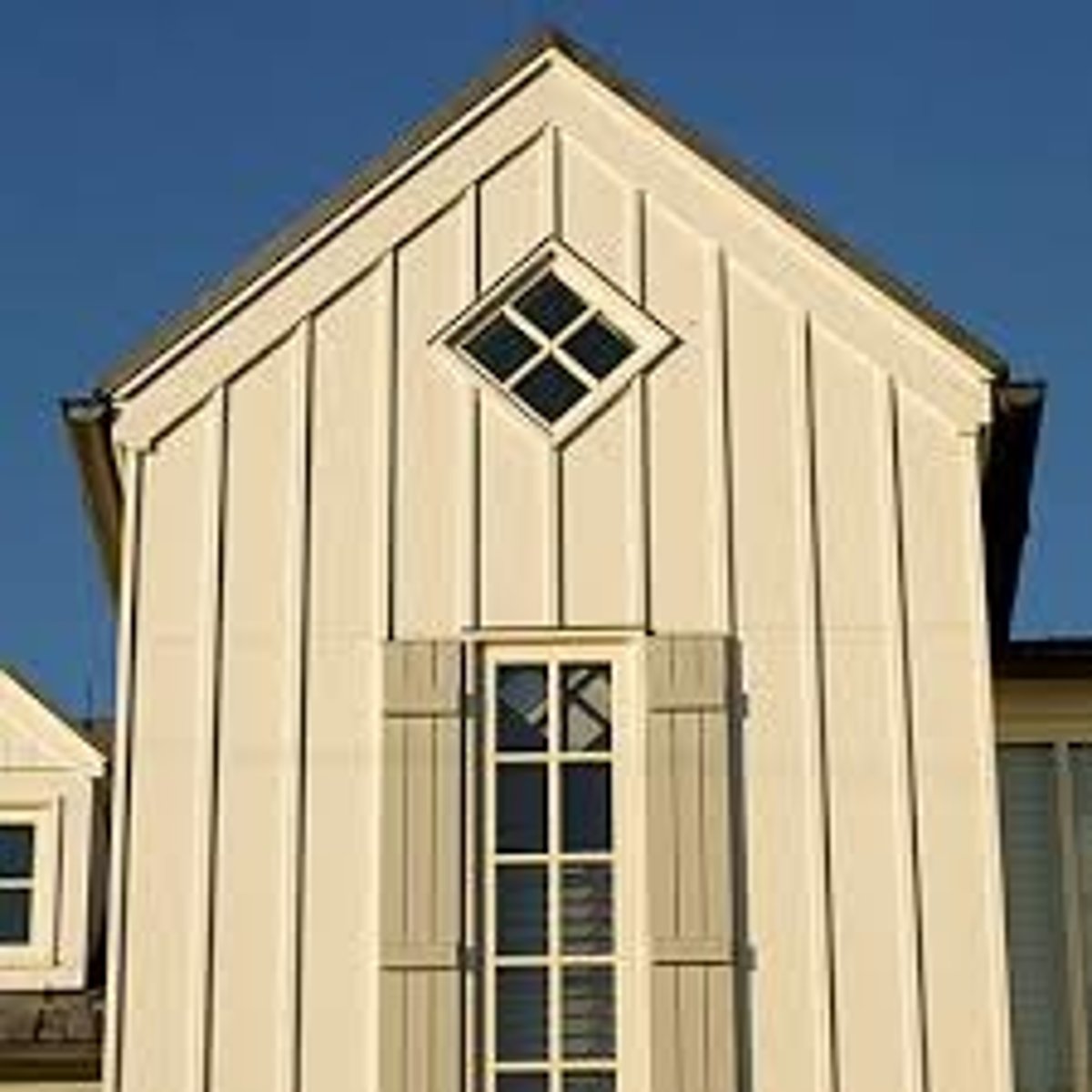 <p>wood siding laid vertically consisting of wide boards and narrow battens</p>