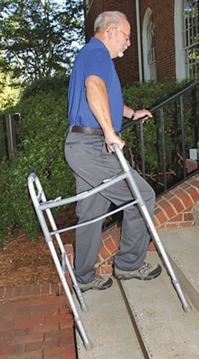 <p>Rail on one side, walker turned sideways on other</p>