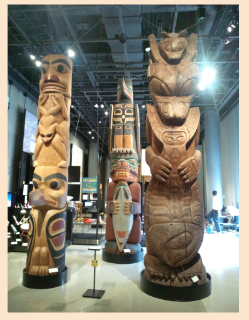 What does bird and animal spirits carved on a wooden pole tell us about Native American life?