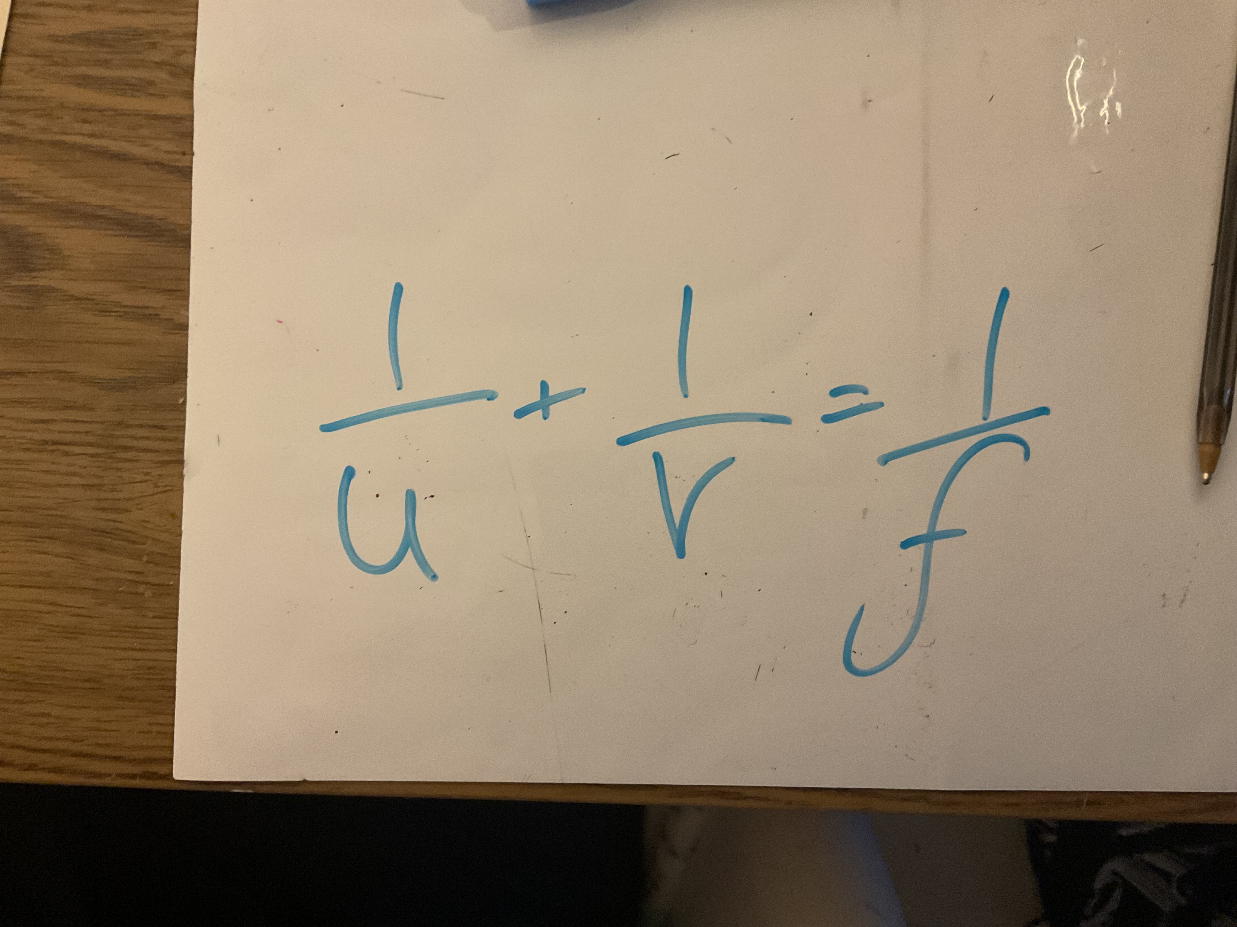 <p>Where u is the distance of the object from the centre of the lens, V is the distance of the image from the centre of the lens and f is the focal length of the lens </p>